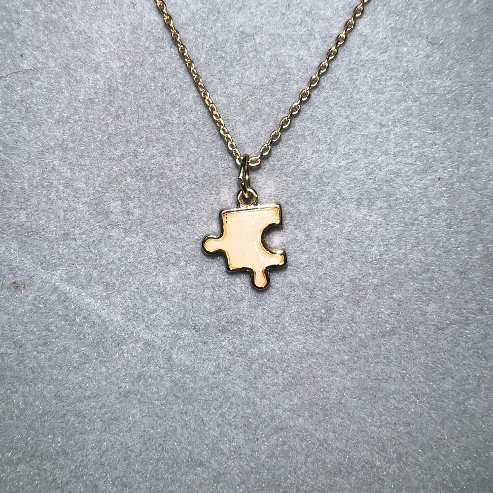 Sweet puzzle piece necklace.  Made in honor of our Autistic loves.